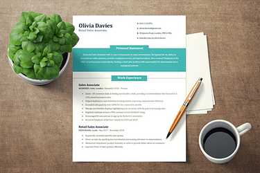 A CV on a desk between a green houseplant and a cup of black coffee to illustrate how to write a CV.