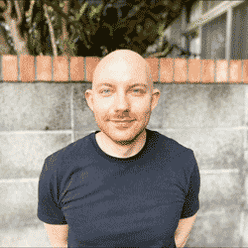 Headshot of Samuel Johns, CPRW for Resume Genius and CV Genius, Resident UK CV Expert